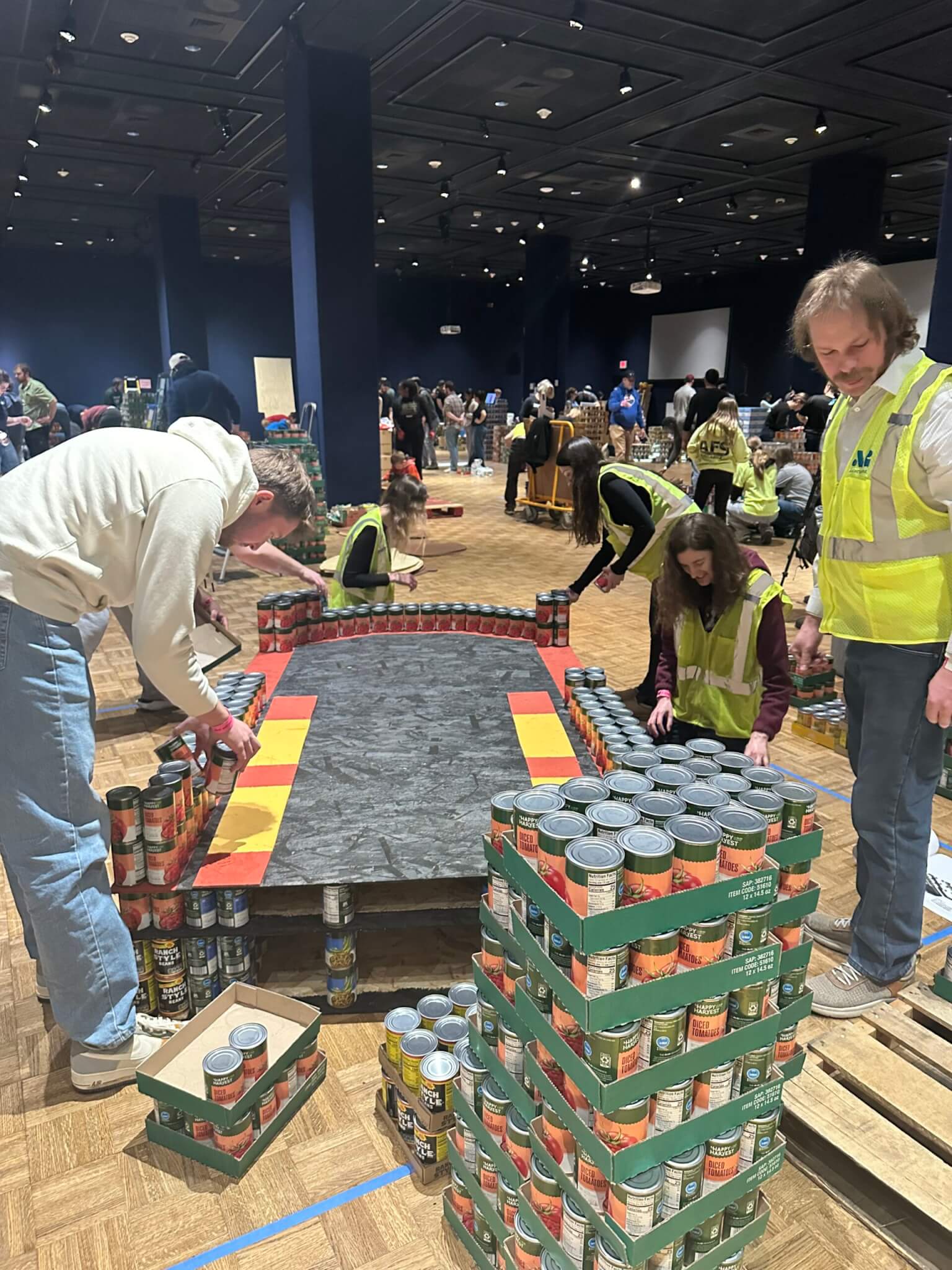 AG's team of builders start the canstruction trolley with a strong base.