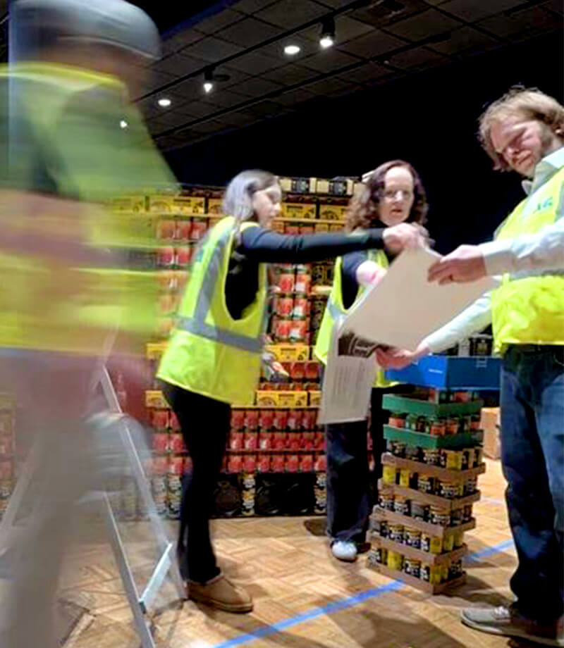 Megan Scott is shown working with her 2026 CANstruction team for which she was the Senior team member leading the group. 