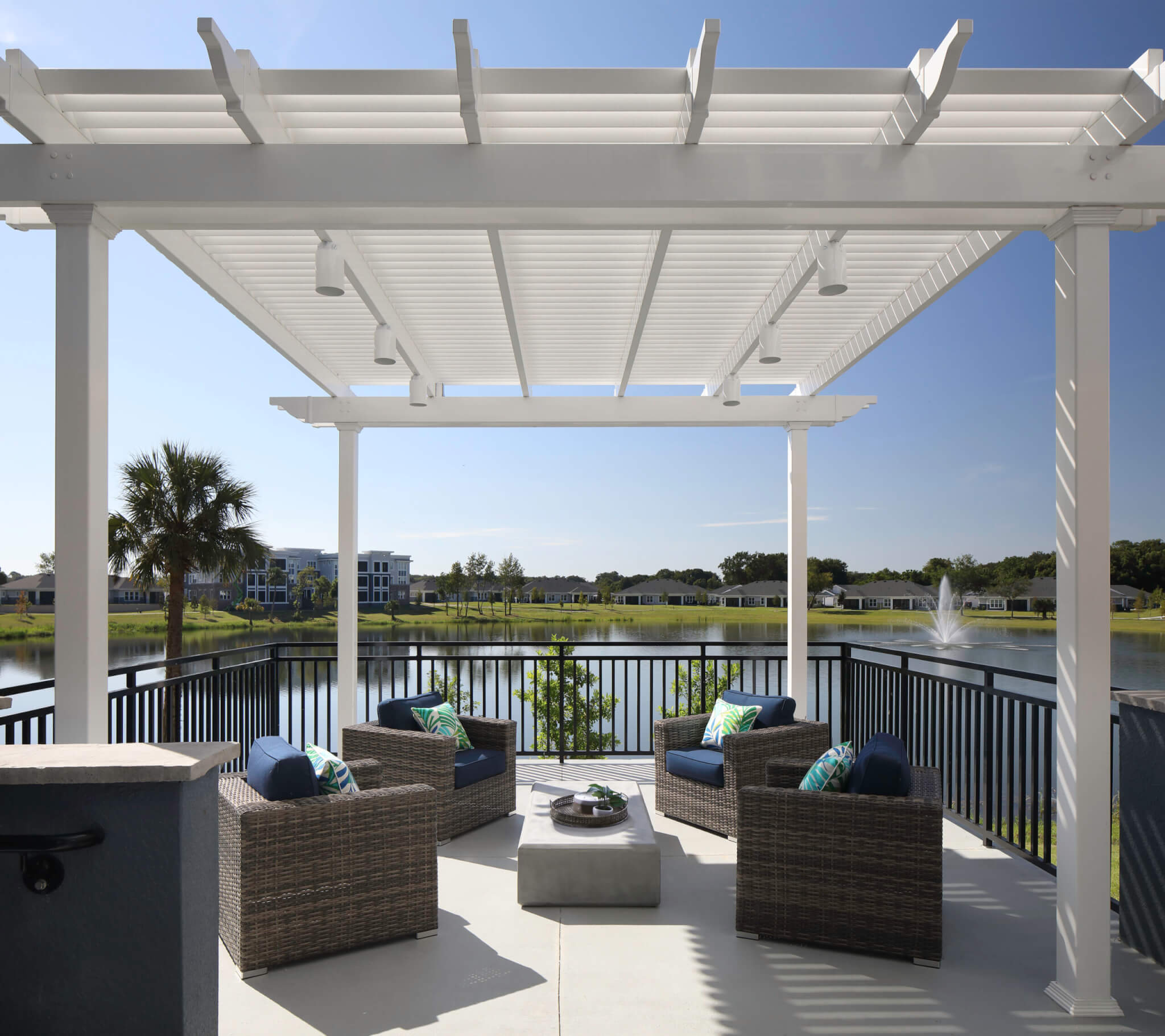 This lounge area connected to the Hybrid Homes at Lakeside at Waterman Village overlooks the water feature on the campus.