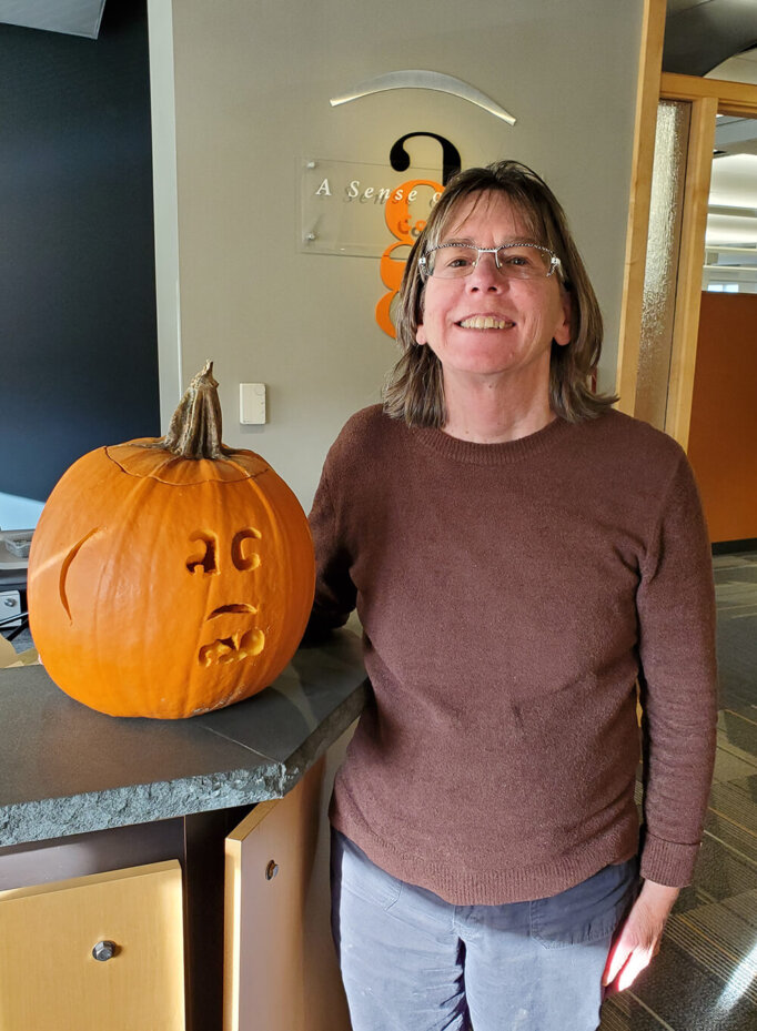 Cindy poses with her carved pumpkin for this photo from 2019.