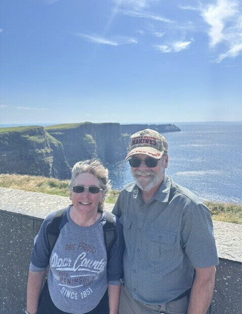 A photo of Cindy and Keith Lofy at Cliffs of Moher in County Clare Ireland during their 2026 vacation.